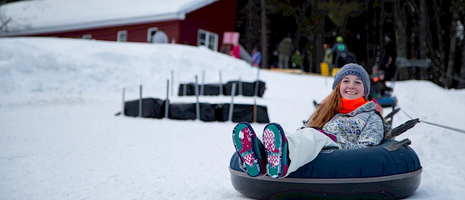 Life appears good for this camper, enjoying a relaxing ride on the Tubing Hill.
Tubing is an optional activity offered several times during the week of camp.