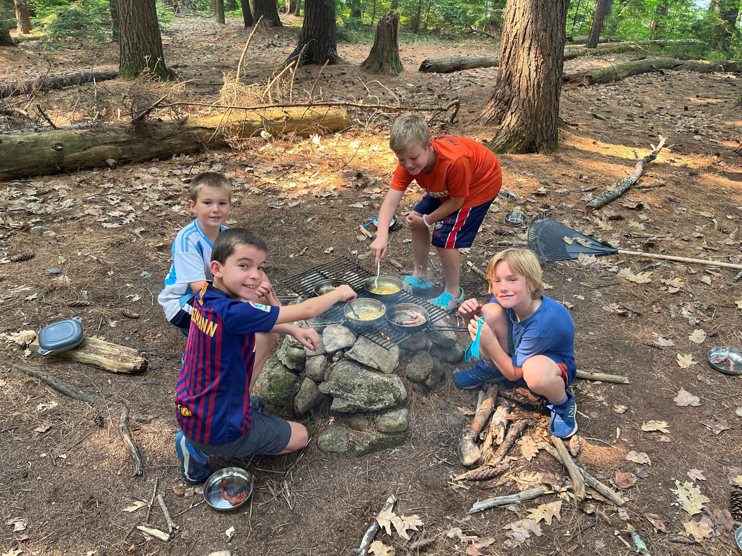 Kids sitting around a campfire